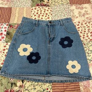 Blue Jean skirt with flower patch work.
